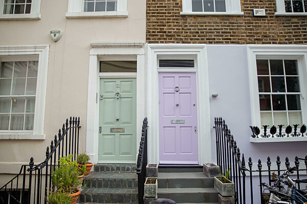Colorful British houses with plants and handrails