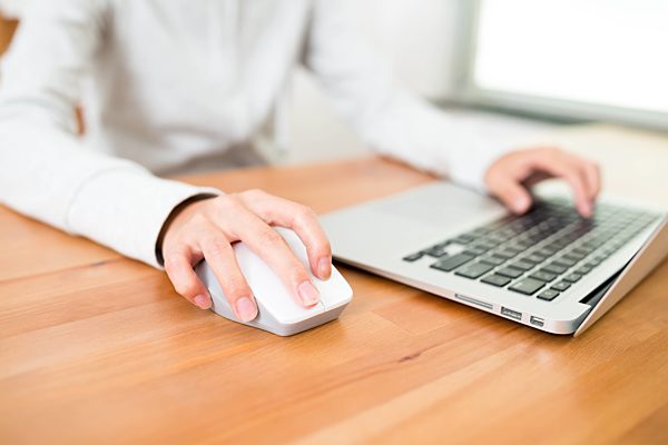 Woman surfing internet by notebook computer