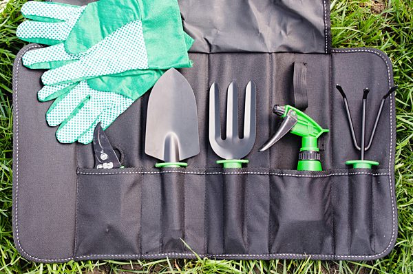 Gardening Tools in the Bag on the Grass.