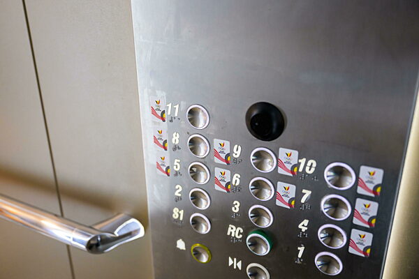 240723 Team Belgium stickers in an elevator in the building of team Belgium...