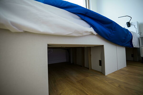 240723 A bedroom made of cardboard in an apartment of team Sweden in the...