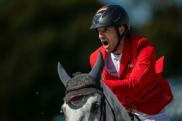 240806 Christian Kukuk of Germany celebrates on horse Checker 47 when...