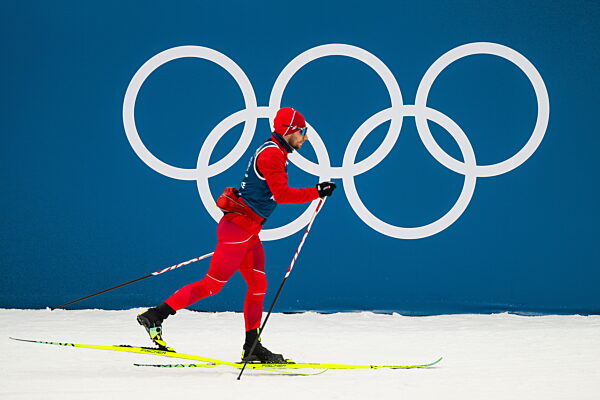 260202 An athlete skis past the Olympic rings at a Cross-Country Skiing...
