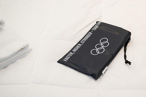 260203 A bag on a bed in an athletes room in Cortina Olympic Village during...