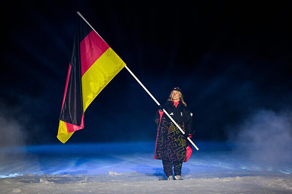 260206 Flag bearer Katharina Schmid of Germany during the Opening Ceremony...