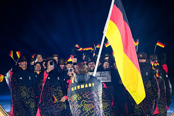 260206 Athletes and flag bearer Katharina Schmid of Germany during the...