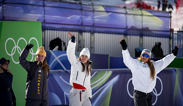 260208 Emma Aicher of Germany, Breezy Johnson of USA and Sofia Goggia of...