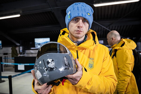260212 Vladyslav Heraskevych of Ukraine with his helmet in the mixed zone...