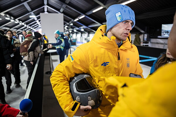 260212 Vladyslav Heraskevych of Ukraine with his helmet in the mixed zone...