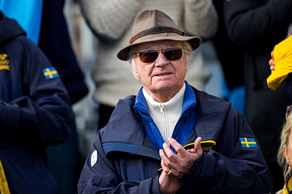 260212 King Carl XVI Gustaf of Sweden in the stands at the women's 10km free...