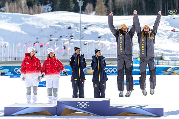 260218 Laura Gimmler of Germany and Coletta Rydzek of Germany celebrate...