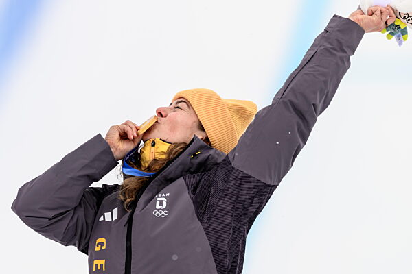 260220 Daniela Maier of Germany celebrates with her gold medal on the podium...