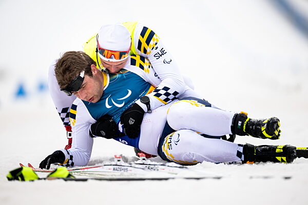 260311 Zebastian Modin of Sweden celebrate with guide Emil Talsi after...