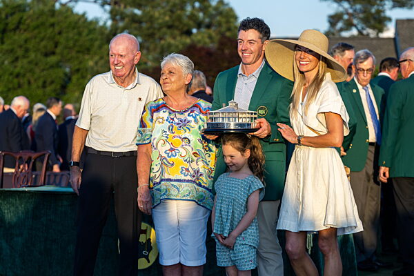 260412 Rory McIlroy of Northern Ireland celebrate with his parents...