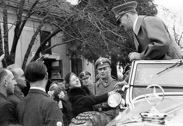 Adolf Hitler speaks with Austrians during his visit to Vienna, 1938