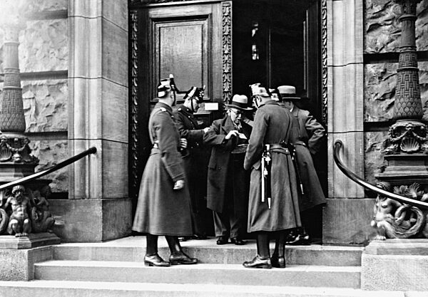 Policemen control members of the parliament, 1932
