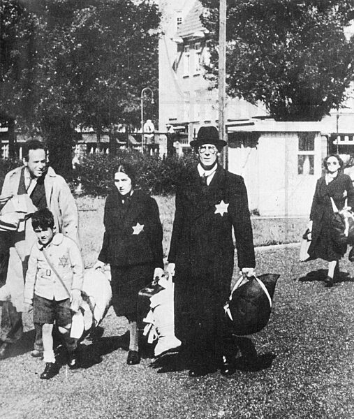 A Jewish family being deported to an extermination camp