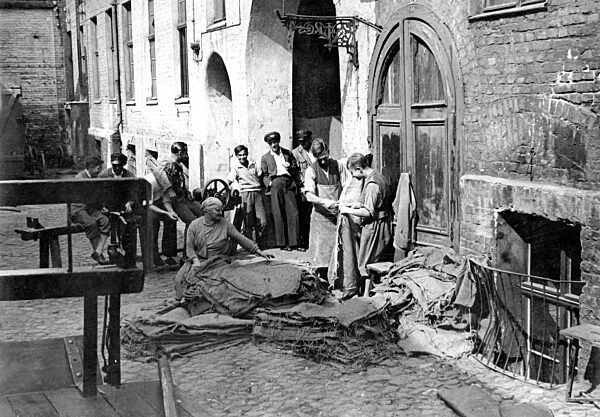 Bag sewing in a backyard in Berlin, 1929