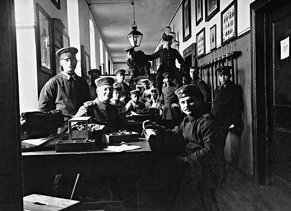 Mending hour in a German barracks, 1908