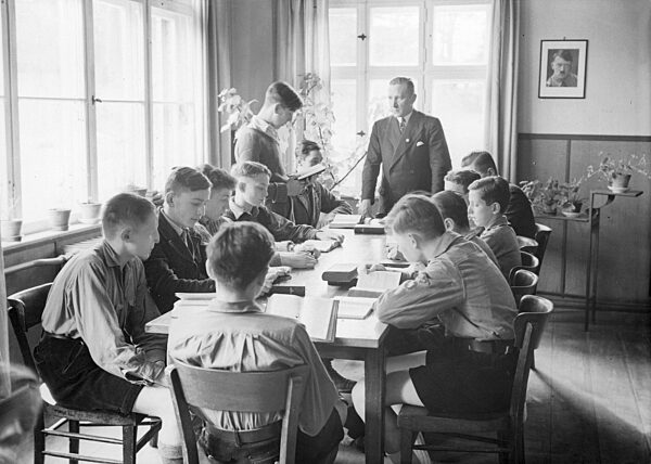 Bible study with confirmees in uniforms of the Hitler Youth