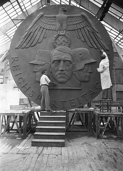 Richard Klein and Albert Allmann edit the badge for the Nuremberg Rally, 1935