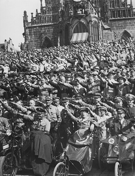 Reich Bishop Ludwig Muller among the cheering spectators in the old town of Nuremberg, 1934