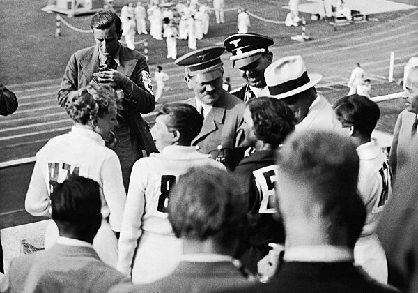 Adolf Hitler congratulates the winners of the javelin throwing, 1936