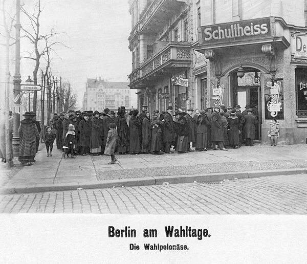 People standing in line in front of the polling station, 1919
