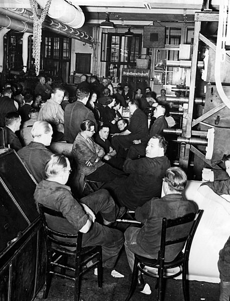 Employees of the Berlin Scherl publishing house while listening to a speech of Hitler, 1939
