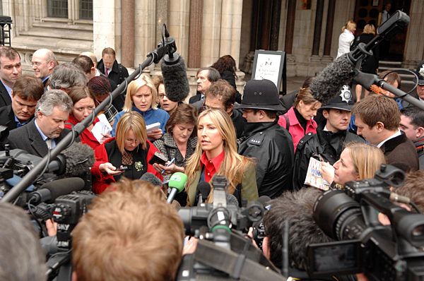 Heather Mills talks to the media outside the High Court in London after she...