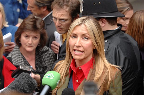 Heather Mills talks to the media outside the High Court in London after she...