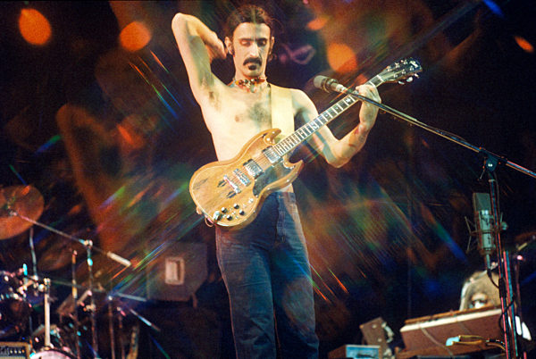 Frank Zappa plays guitar