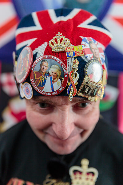 Royal Super fan, John Loughrey, with some of his King Charles souvenirs. London, UK