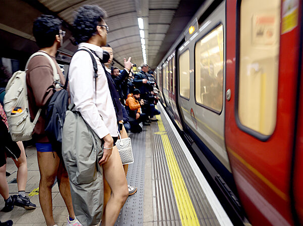 The 11th Annual 'No Trousers Tube Ride' held on the London Underground in London, UK, 7 January 2023