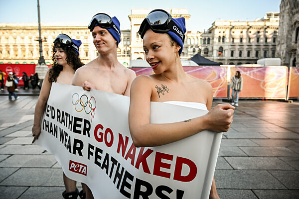 PETA protests "We'd Rather go naked than wear feathers!" before the Olympics.