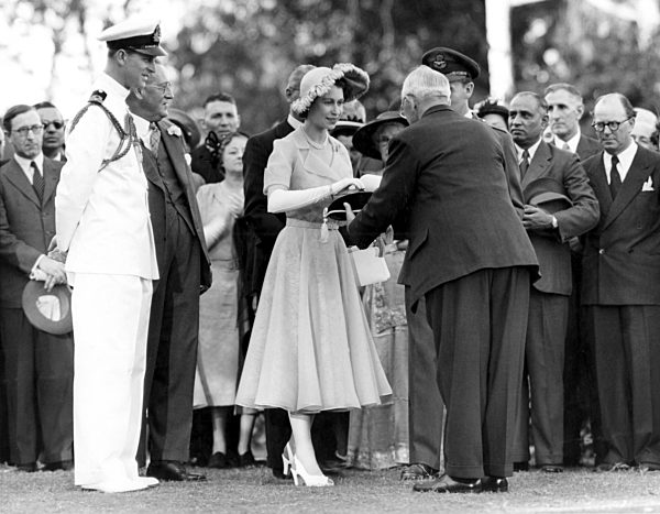 Princess Elizabeth receives the key and title deeds of Royal Lodge from Mr W...