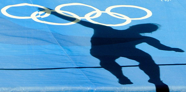 The shadow of Jennifer Oeser of Germany is seen on the mat during the...