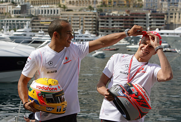 British Formula One driver Lewis Hamilton (L) of McLaren Mercedes and his...