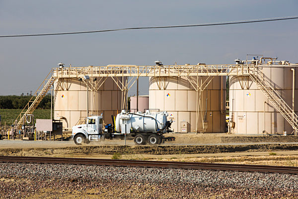 A fracking site being fracked near Wasco in California's Central Valley, USA. Fracking for natural gas and oil, has reduced energy prices in the US, but fracking is a water hungry industry, that competes directly with the agricultural sector for water. Aft