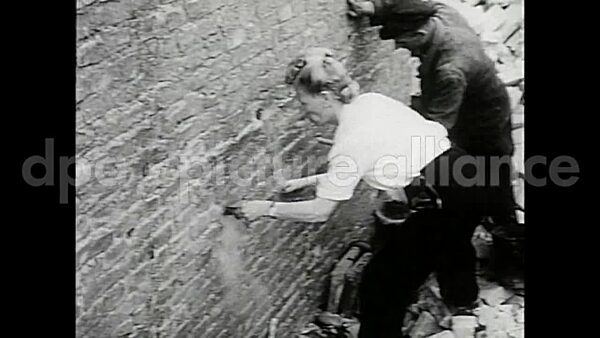 September 2, 1949 – Berlin Germany: A woman dubbed Mrs. Dynamite supervises demolition of war-scarred buildings in Berlin.