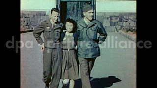 October 27, 1945 – Tokyo Japan: American soldiers and Japanese girls out for a stroll in Tokyo, Japan.