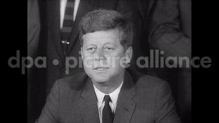 October 7, 1963 – Washington DC White House USA: President John F Kennedy signs Limited Nuclear Test Ban Treaty at Treaty Room of White House in Washington DC.