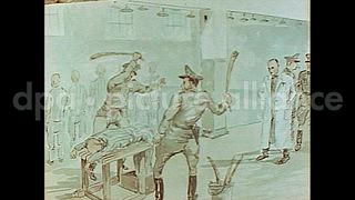 June 1945 – Dachau Germany: Paintings depicting torture done to prisoners at the Dachau concentration camp of Nazis in Germany