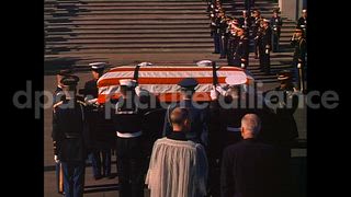 November 25, 1963 – Washington DC USA: Flag-draped casket of slain President John F. Kennedy carried by horse-drawn caisson, leaving United States Capitol.