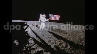 February 5, 1971 – The Moon: NASA Apollo 14 mission. Lunar Module, Antares, on the moon. Astronauts Shepard and Mitchell plant a U.S. flag