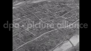August 28, 1945 – Japan: Aerial view from U.S. Army aircraft flying over Japan after the end of WW II. Views of industrial and rural areas.