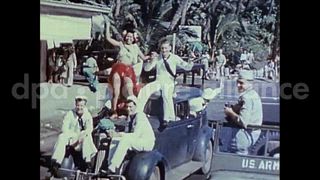 August 15, 1945 – Honolulu Hawaii USA: Crowd of service men and civilians gather to celebrate the VJ day in Honolulu to mark the end of World War 2