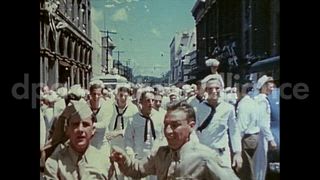 August 15, 1945 – Honolulu Hawaii USA: People throw torn papers and confetti from roof tops during the celebration of VJ day at the end of World War II.