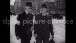 October 3, 1946 – Czechoslovakia: A few German citizens, wearing arm brassards as identification marks, on the streets in Usti, Sudetenland, Czechoslovakia