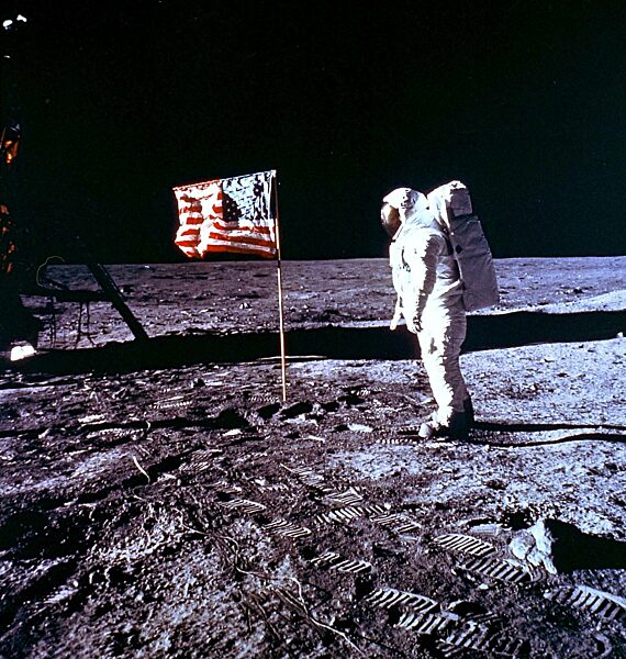 Edwin Aldrin on the Moon in front of the USA flag